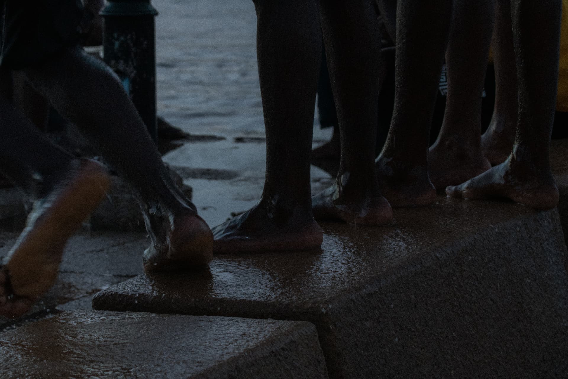 Still — feet on wet stone
