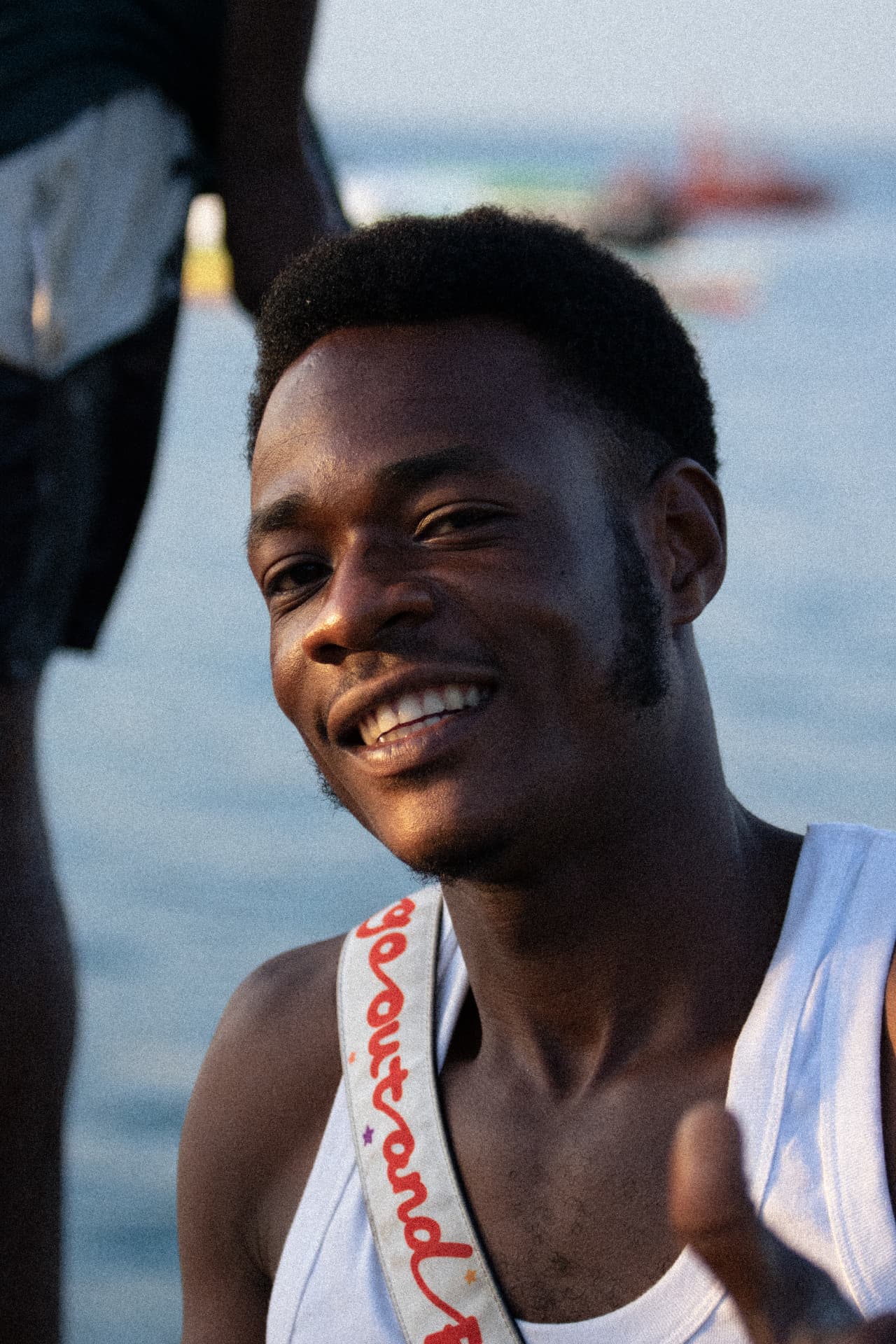 Portrait — smiling man by the sea